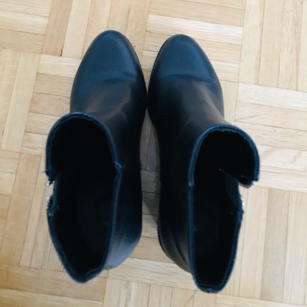 Black booties with gold zipper